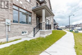 Cambridge apartment for rent - A residential building with a well-maintained lawn in front.