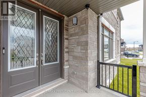 Cambridge apartment for rent - A house entrance with a glass door and a window.