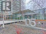 Toronto (High Park-Swansea) condo for rent - A sign with the number 105 is in the foreground of a building.
