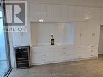Toronto (High Park-Swansea) condo for rent - A white room with a table and chairs.