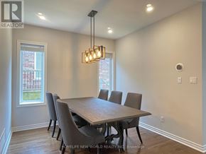 Oakville (Wm Westmount) apartment for rent - A dining room with a wooden table and chairs.