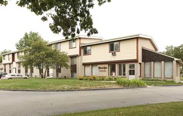 Westland apartment for rent - A building with a brown sign on the front.