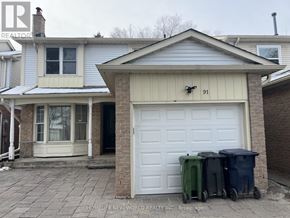 Toronto (Milliken) apartment for rent - A house with a white garage door and a number 91 on the wall.