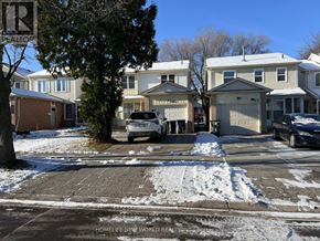 Toronto (Milliken) apartment for rent - A residential street with houses and parked cars.