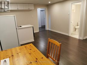Toronto (Newtonbrook West) apartment for rent - A realtor photo of a room with a table and a chair.