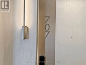 Toronto (Waterfront Communities) condo for rent - A door with a handle and a sign that says "ZON".