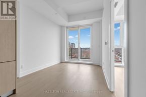 Toronto (Yonge-Eglinton) condo for rent - A room with a view of the city through a window.