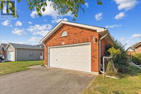 Brant (Paris) apartment for rent - A red brick house with a white garage door in front.