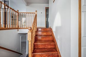 Brant (Paris) apartment for rent - A wooden staircase with a railing on the left side.