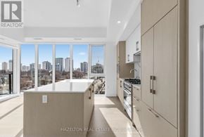 Toronto (Yonge-Eglinton) condo for rent - A modern kitchen with wooden cabinets and a view of the city.