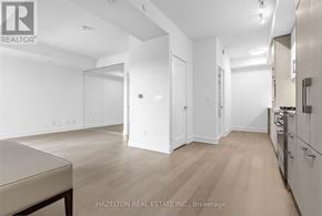 Toronto (Yonge-Eglinton) condo for rent - A spacious kitchen with white cabinets and a dining table.