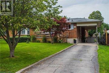 London South (South G) apartment for rent - A house with a driveway and a tree in front of it.