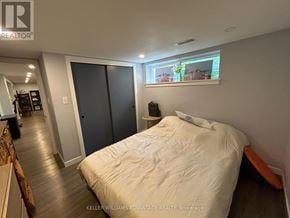 Toronto (Woburn) apartment for rent - A bedroom with a bed, a window, and a sliding door.