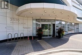Mississauga (Central Erin Mills) condo for rent - The entrance to a building with a sign that reads "2520 Eglinton Ave W".