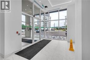 Brantford condo for rent - A bright white interior with a black and white rug in front of a glass door.