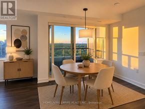 Toronto (North St. James Town) condo for rent - A dining room with a table set for four and a view of the city.