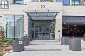 Toronto (Banbury-Don Mills) condo for rent - The entrance to a building with a glass door and a sign that reads "10 RUN ON THE PARK DRIVE".