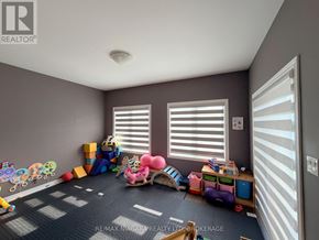 Welland (Lincoln/Crowland) apartment for rent - A room with toys scattered on the floor and a window with blinds.