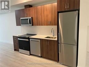 Barrie (Painswick South) condo for rent - A kitchen with a refrigerator, microwave, dishwasher, and stove.
