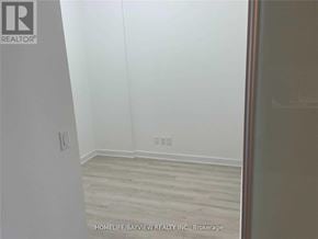 Barrie (Painswick South) condo for rent - A room with wooden flooring and white walls.