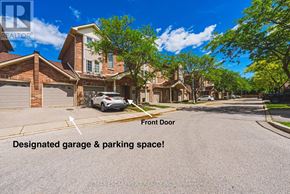 Burlington (Rose) townhouse for rent - A house with a car parked in front and a sign that says "Designated garage & parking space!".