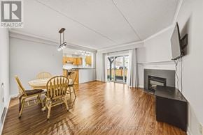 Burlington (Rose) townhouse for rent - A living room with a fireplace and a television.