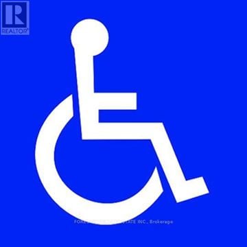 Toronto (Brookhaven-Amesbury) apartment for rent - A blue sign with a white wheelchair symbol and the words "REALTOR" and "FOREVER" on it.