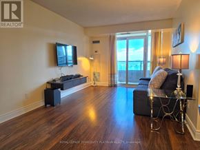 Markham (Unionville) condo for rent - A living room with a television, a couch, and a glass table.