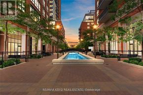 Toronto (Yorkdale-Glen Park) condo for rent - A pool in the middle of a brick patio surrounded by trees.