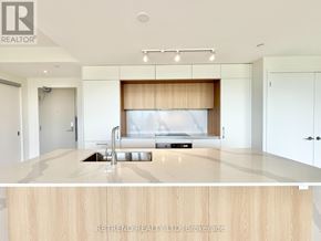 Toronto (Annex) condo for rent - A modern kitchen with a wooden countertop and a sink.