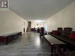 Markham (Thornhill) apartment for rent - A long hallway with a bench on the left and a table with chairs on the right.