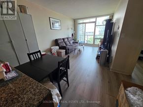 Toronto (Waterfront Communities) condo for rent - A living room with a black table and chairs.