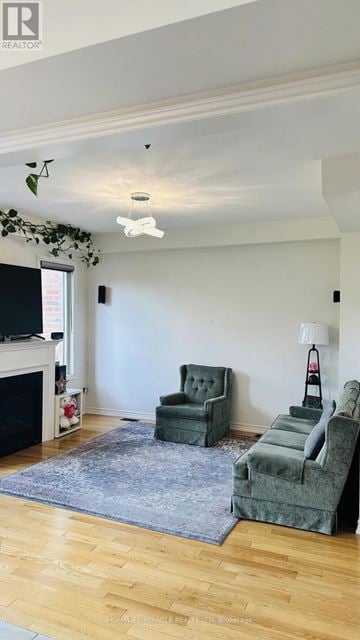 Ajax (Northwest Ajax) townhouse for rent - A living room with a grey rug and two grey armchairs.
