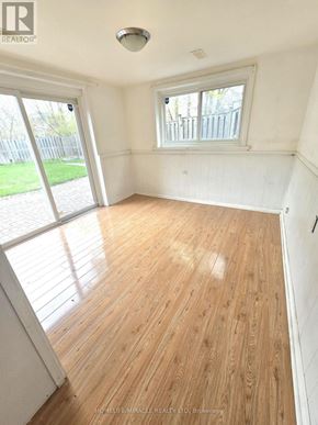 Toronto (L'amoreaux) apartment for rent - A room with wooden flooring and a window.