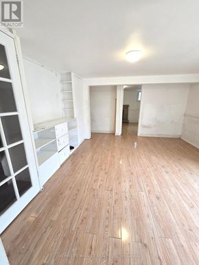 Toronto (L'amoreaux) apartment for rent - A room with wooden flooring and white walls.