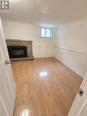 Toronto (L'amoreaux) apartment for rent - A room with a fireplace and a window.