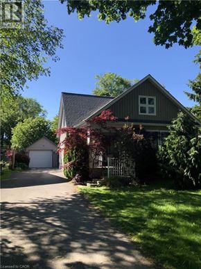 Niagara-On-The-Lake apartment for rent - A house with a grey roof and a white garage door.