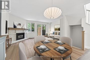 Oakville (Co Central) townhouse for rent - A dining room with a wooden table set for four.