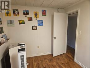 Coquitlam apartment for rent - A room with a white door and a wall with pictures on it.