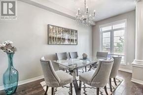 Oakville (Go Glenorchy) townhouse for rent - A dining room with a glass table and chairs.