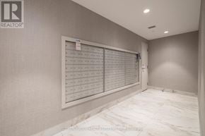 Milton (Walker) condo for rent - A realtor logo is on the wall in a room with a calendar.