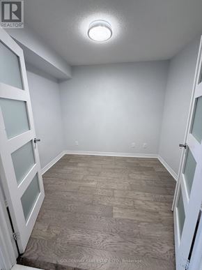 Toronto (Bayview Village) condo for rent - A room with white walls and a tiled floor.