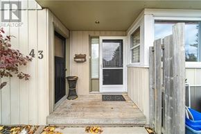 Brantford apartment for rent - The image shows the front porch of a house with the number 43 on the wall.