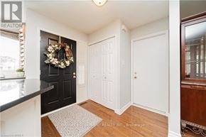 Brantford apartment for rent - A black door with a wreath on it.