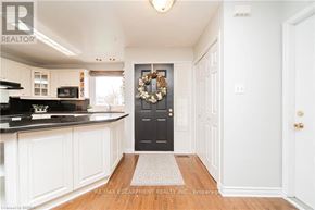 Brantford apartment for rent - A black door with a wreath on it is the focal point of this image.