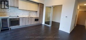 Toronto (Humewood-Cedarvale) condo for rent - A kitchen with a wooden counter top and a stainless steel oven.