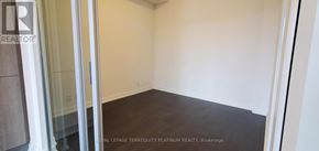 Toronto (Humewood-Cedarvale) condo for rent - A room with a wooden floor and white walls.