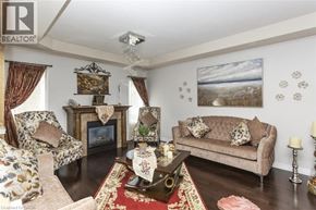 Hamilton apartment for rent - A living room with a fireplace and a painting on the wall.