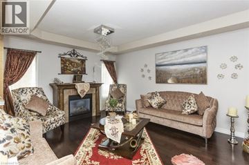 Hamilton apartment for rent - A living room with a fireplace and a painting on the wall.