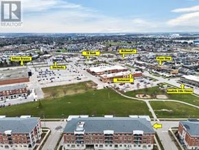 Kitchener condo for rent - An aerial view of a city with a Starbucks and a McDonald's.